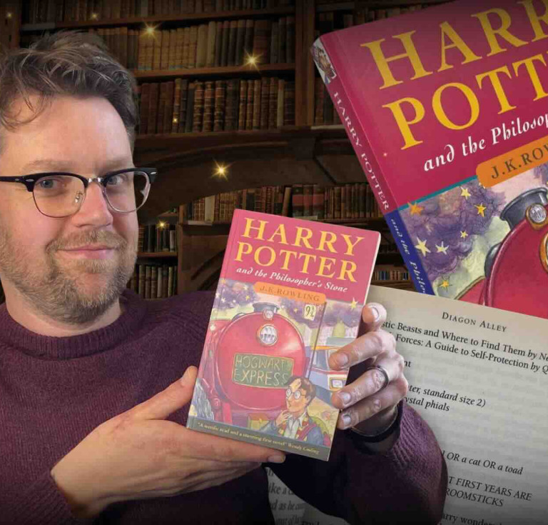 Jim Spencer with the paperback copy of Harry Potter and the Philosopher’s Stone