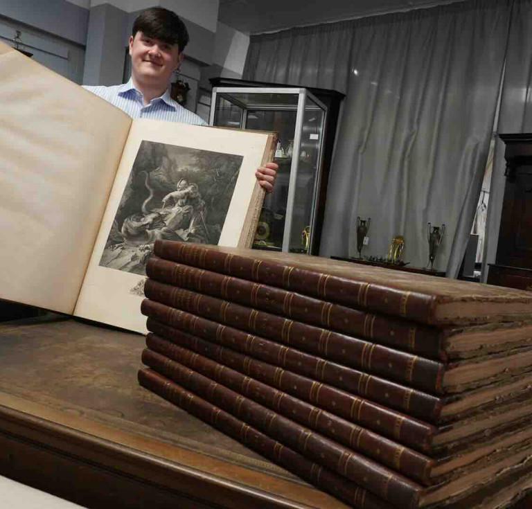 Auctioneer Jack Orgill with the books